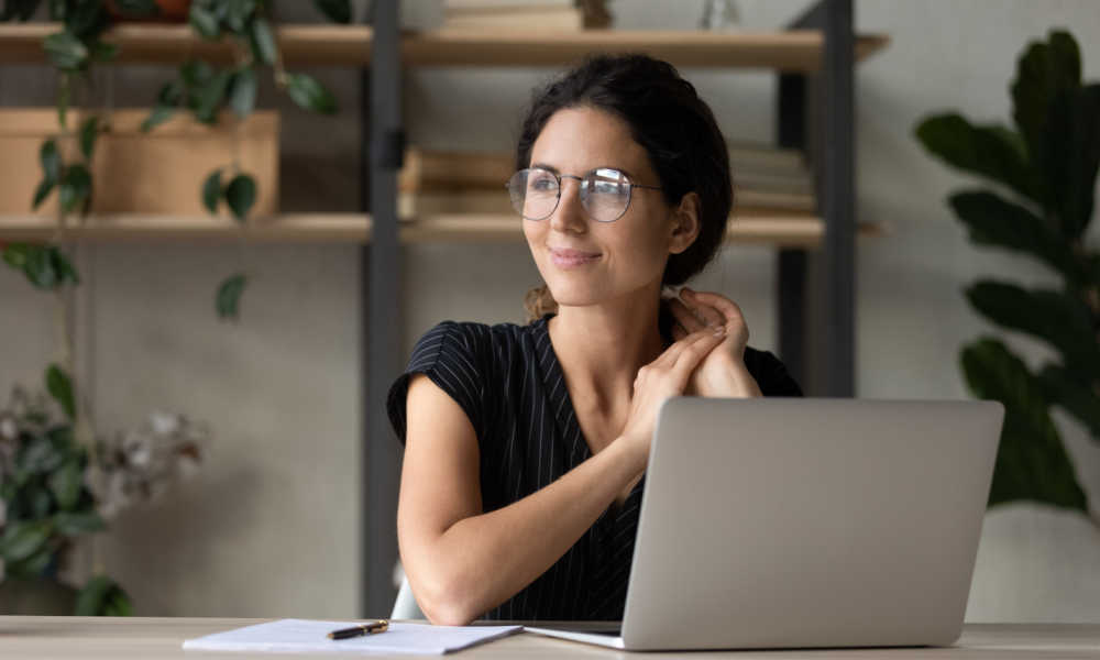 A remote worker at home working on her laptop